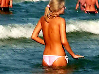 Cute next door blonde and her boyfriend are swimming in the sea, the girl is all wet and has no bra, only sexy pantys on